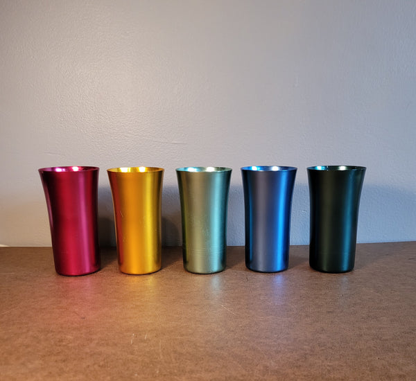 Set of 5 metal drinking vessels.